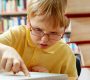 curious child with laptop 90x80